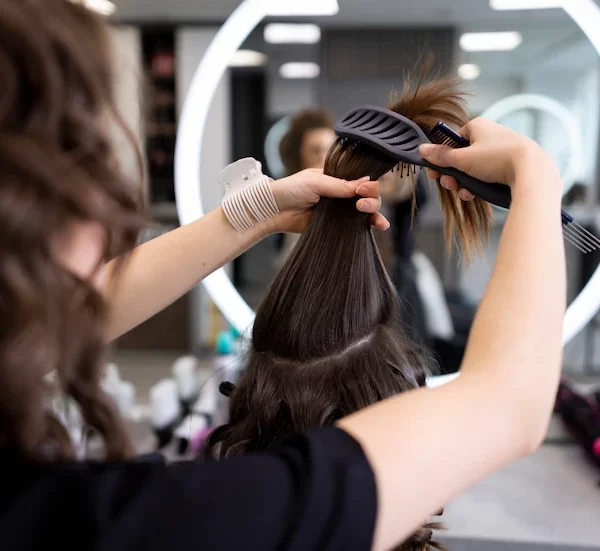 hairdresser-taking-care-her-client_23-2149319808